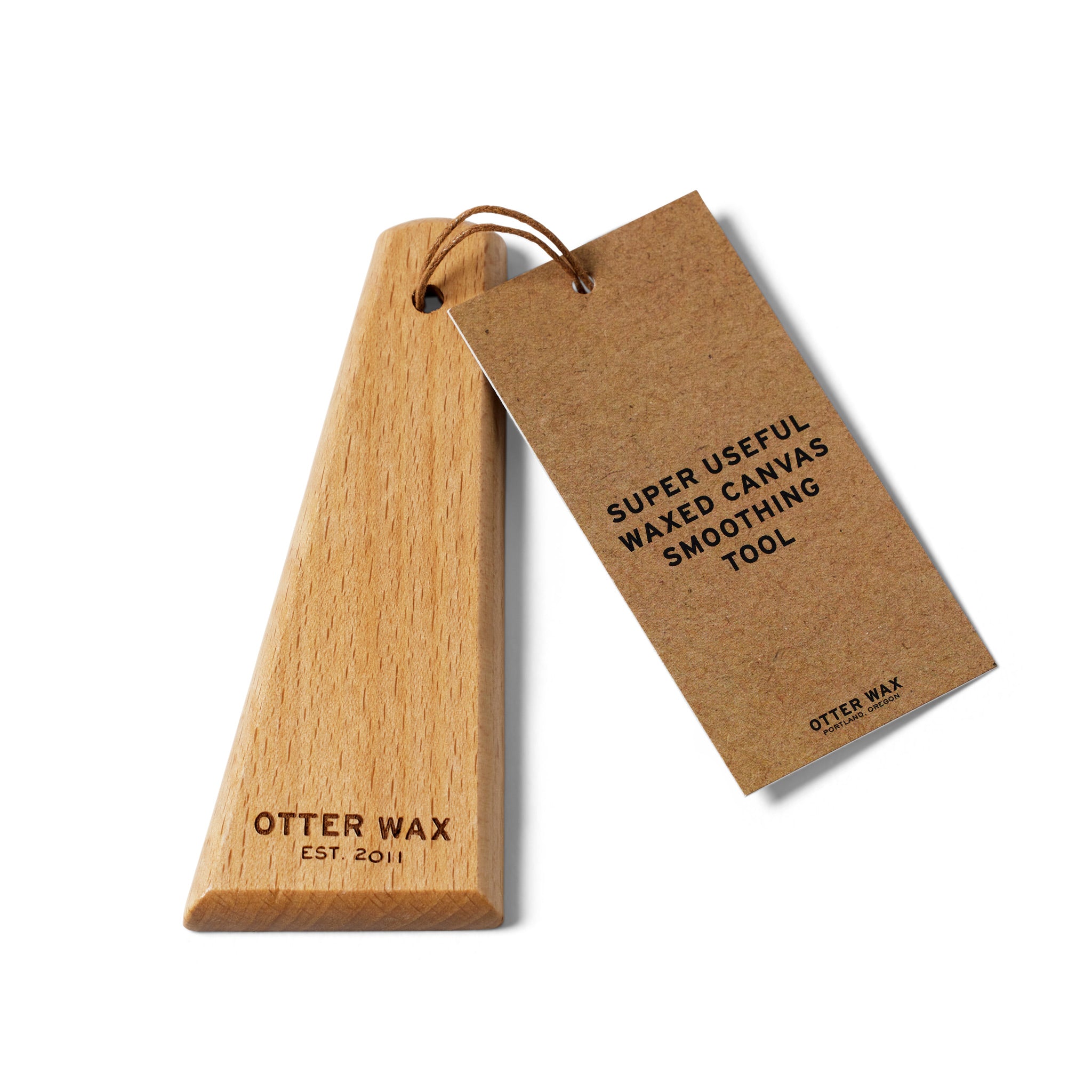 Otter Wax smoothing tool made from polished hardwood, designed to smooth and restore the surface of waxed canvas.