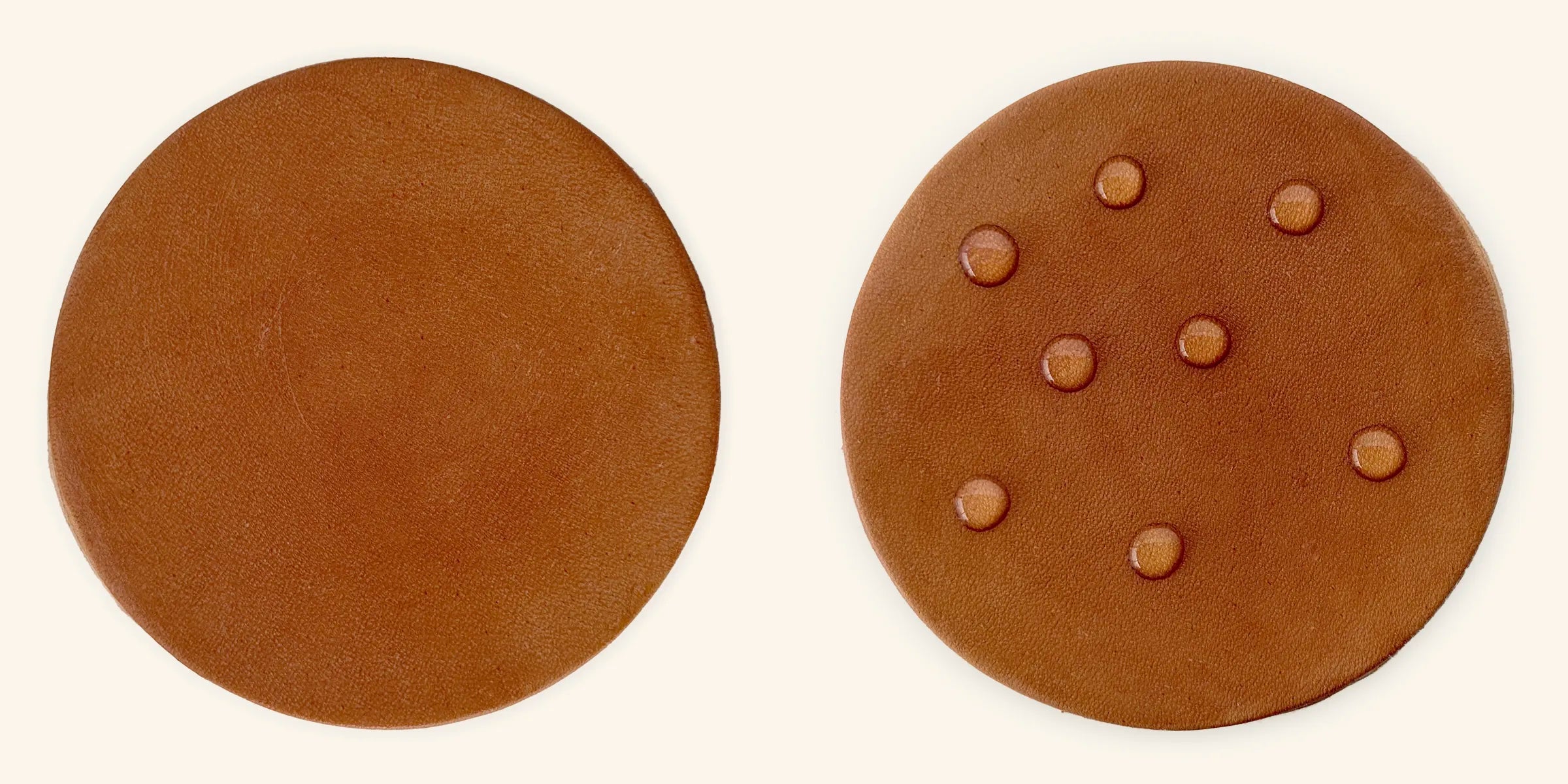 a piece of light colored leather showing before and after treatment of Otter Wax Boot Wax