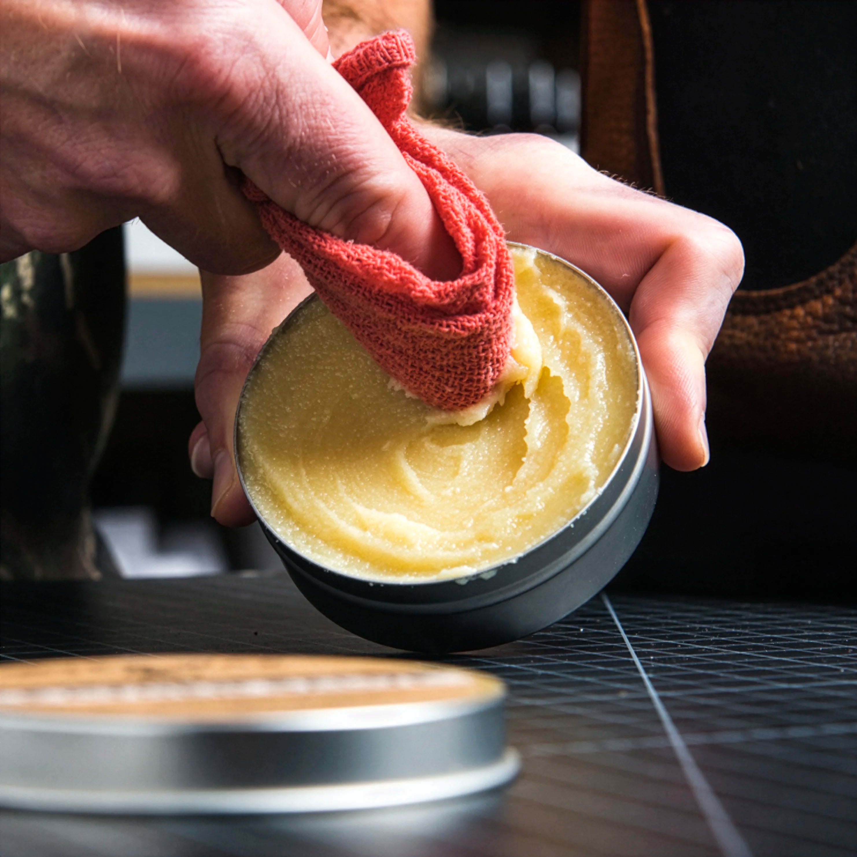 otter wax leather salve being applied to cloth