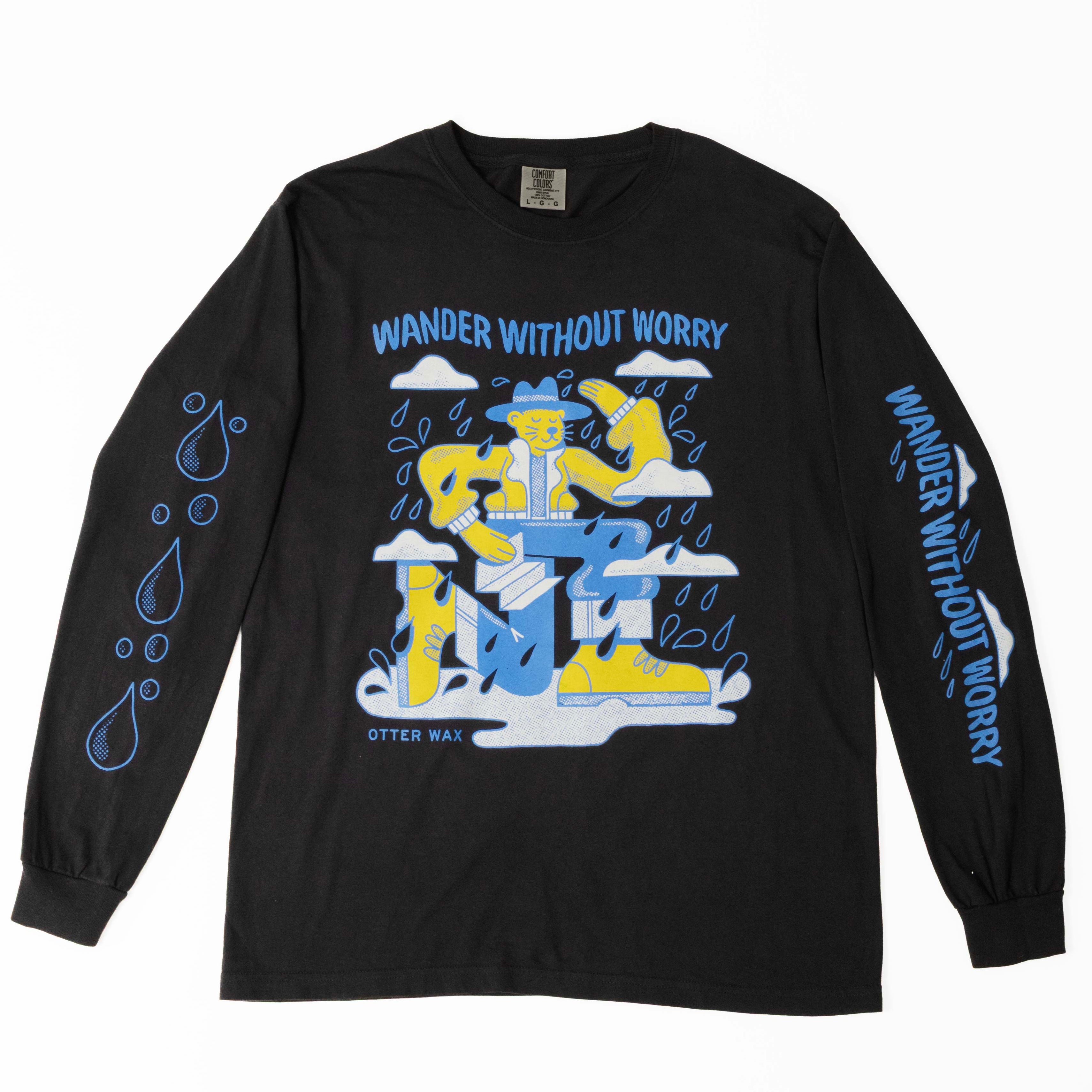 Black Otter Wax long sleeve t-shirt featuring a colorful “Wander Without Worry” graphic of an otter in outdoor gear surrounded by raindrops and clouds.